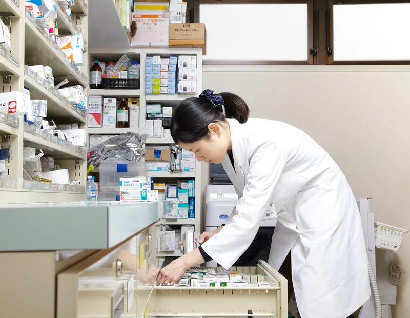 Pharmacist checking medical supplies