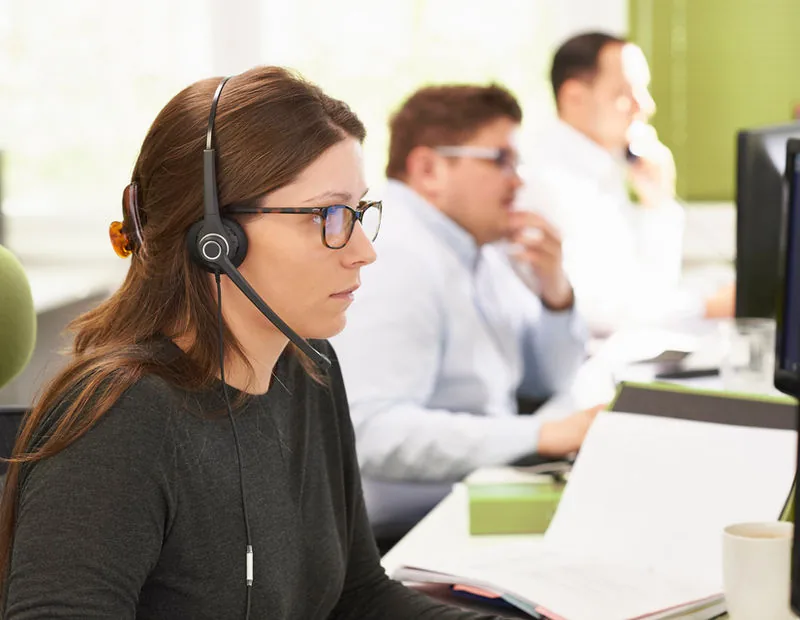 Customer engagement team at work with headsets